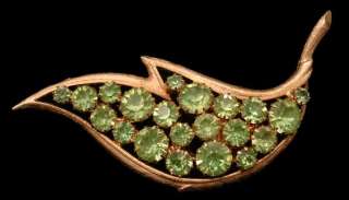 Textured goldtone 2” x 3 ¼” leaf brooch with prong set lime green 