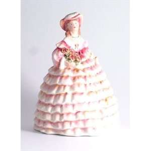   crinoline dress and pink hat holding a roses bouquet