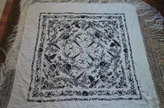   hand embroidered Asian scenes and a wonderful hand knotted fringe