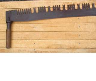 for a terrific antique crosscut saw Has its original wooden handles 