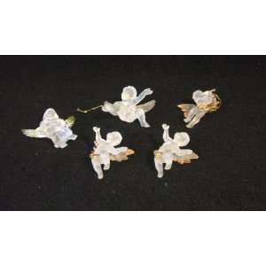  Angels 2 tall, frosted plastic. Wings have gold trim. These angels 