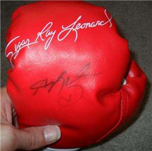 Signature is hand signed a mini boxing glove (left hand). Please click 